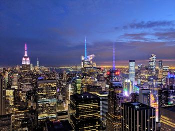 Illuminated buildings in city at night