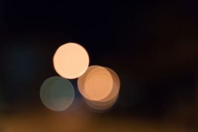 Defocused image of lights against black background