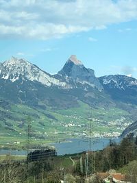 Scenic view of snowcapped mountains against sky