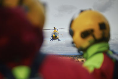 Paramedics as they looking at the approaching helicopter of emergency medical service. 
