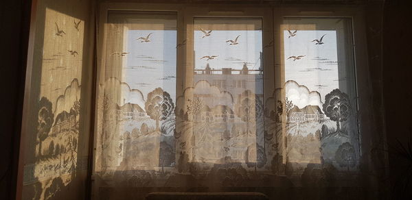 Exterior of historic building seen through window