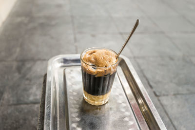 High angle view of vietnamese coffee drink on tray