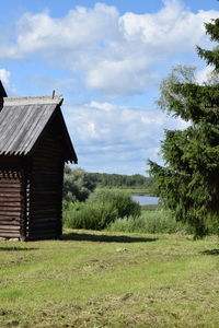 House on field against sky