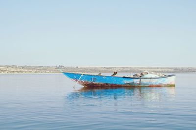 Boats moored in calm sea