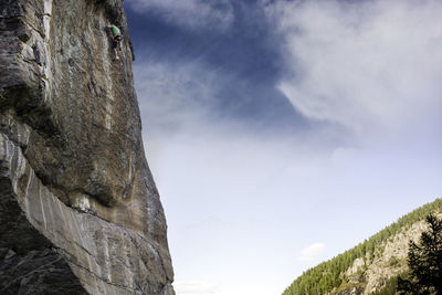 Low angle view of rock formation against sky