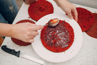 Cropped hand of person preparing food