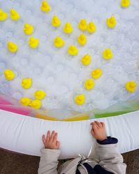 Cropped hand on inflatable pool