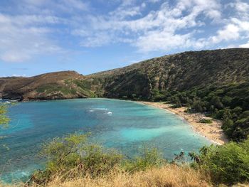 Scenic view of bay against sky