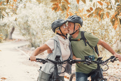 Side view of woman riding bicycle