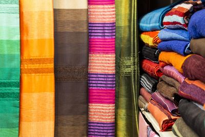 Multi colored fabrics arranged in shelf