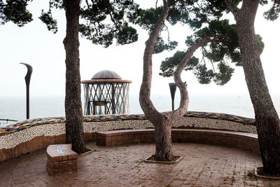 Built structure on beach against sky