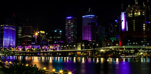 Illuminated buildings in city at night