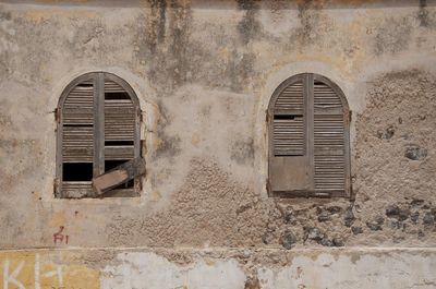 Metal grate on brick wall
