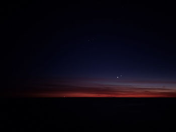 Scenic view of sea against sky at night