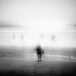 Woman standing in foggy weather