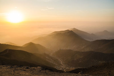 Scenic view of mountains against sky during sunset