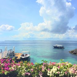 Scenic view of sea against cloudy sky