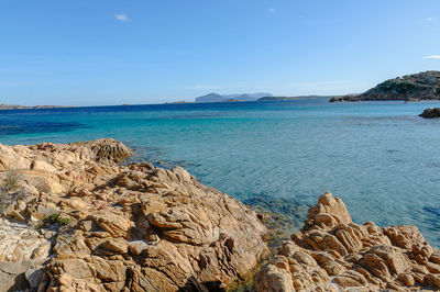 Scenic view of sea against blue sky