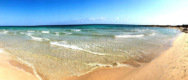 Scenic view of beach against sky