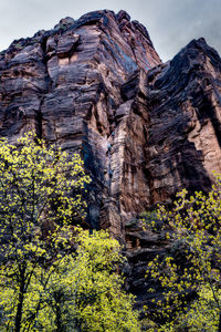 Low angle view of rock formation against sky