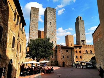 Buildings in city against sky