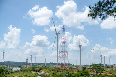 Low angle view of electricity pylon against sky