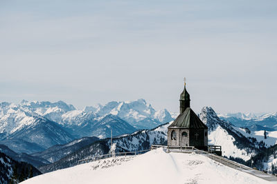 High angle view of old church against mountain view during winter