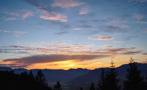 Scenic view of silhouette mountains against sky at sunset