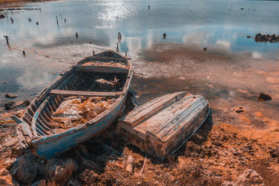 High angle view of abandoned boats moored on shore