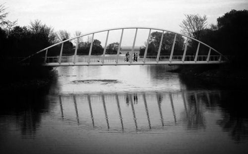 Bridge over river with buildings in background