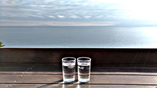 Close-up of water on table against sea