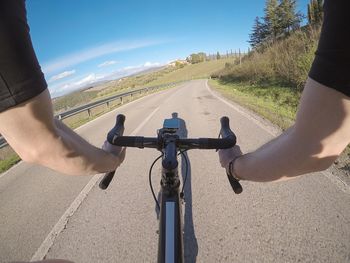 Man riding bicycle on road