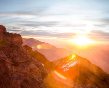 Scenic view of rock formation against sky during sunset