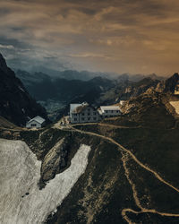 Aerial view of snowcapped mountains against sky