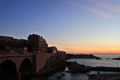 Historic buildings against sky during sunset