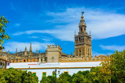 Low angle view of seville cathedral ?
against sky