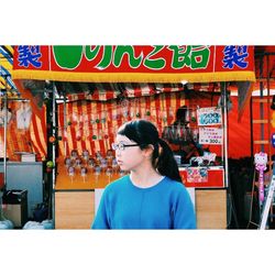 Young woman standing in store