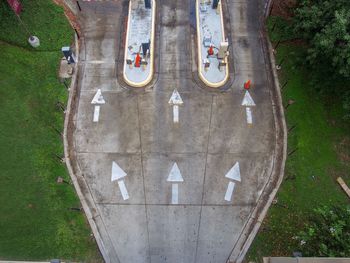 High angle view of arrow sign on road