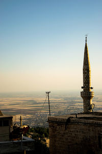 Panoramic view of buildings in city against clear sky