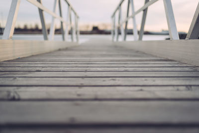 Close-up of wooden jetty against sky