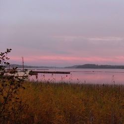 Scenic view of lake against sky during sunset