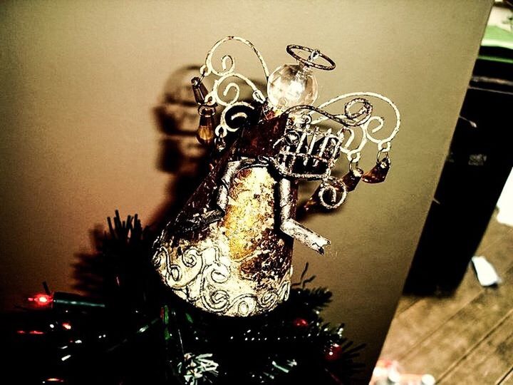 CLOSE-UP OF CHRISTMAS DECORATIONS HANGING ON TABLE