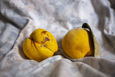 Close-up of yellow fruits on bed