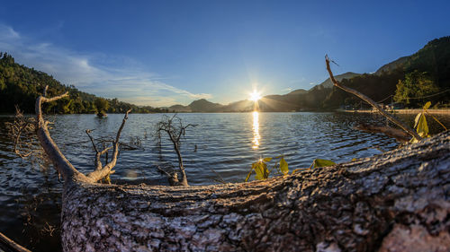 Scenic view of lake against sky during sunset