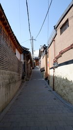 Empty alley amidst buildings in town