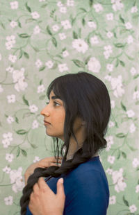 Portrait of a young woman looking away