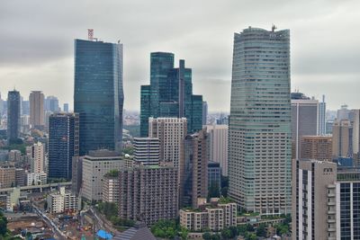 Modern buildings in city against sky