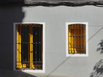 Close-up of yellow window of building