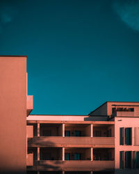 Low angle view of buildings against blue sky