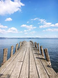 Pier over sea against sky